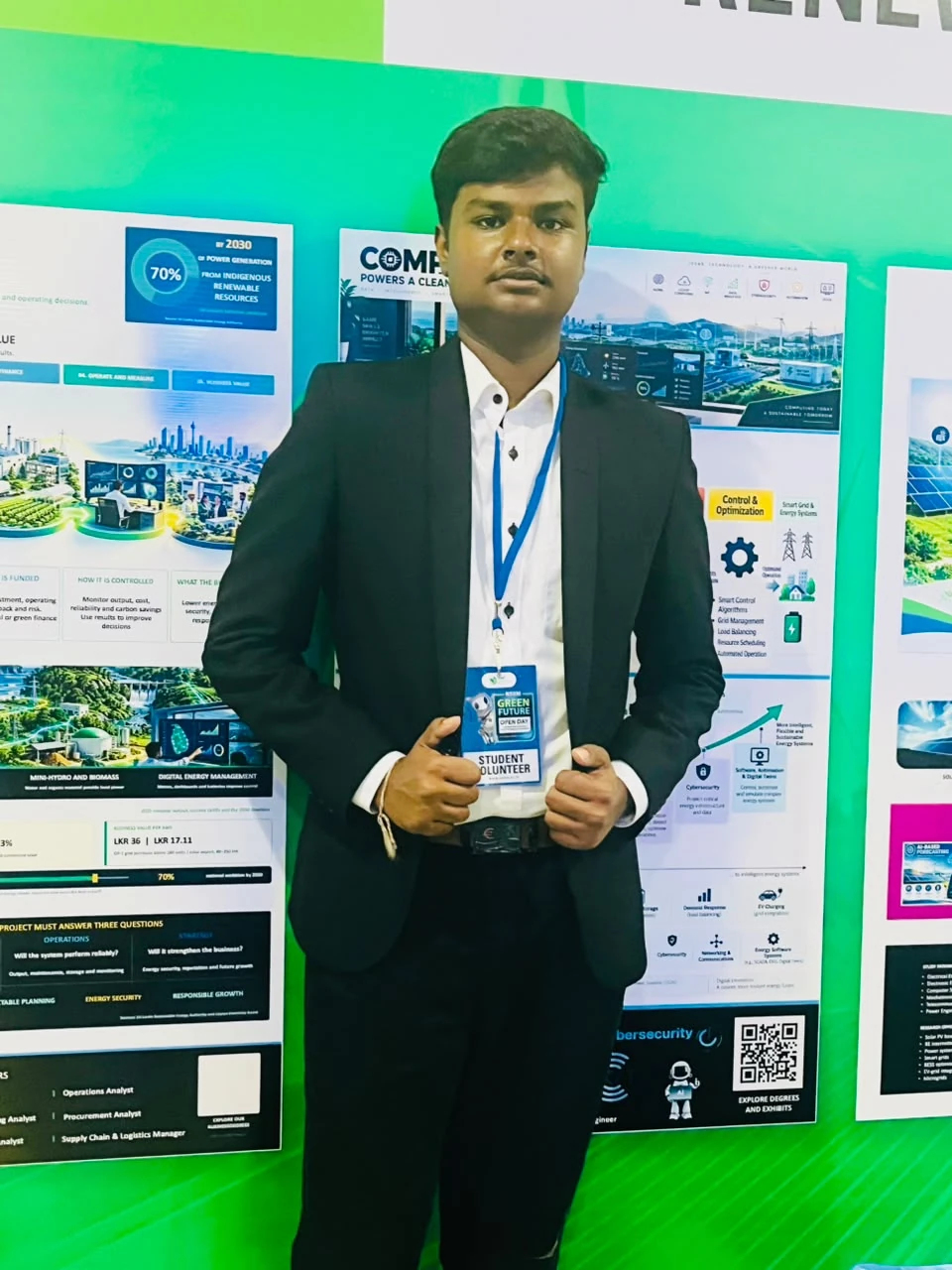 A club member in a black blazer and white shirt standing in front of the Open Day displays